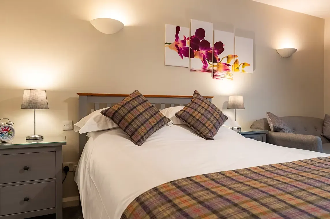 Room One with king-size bed and colourful wall art